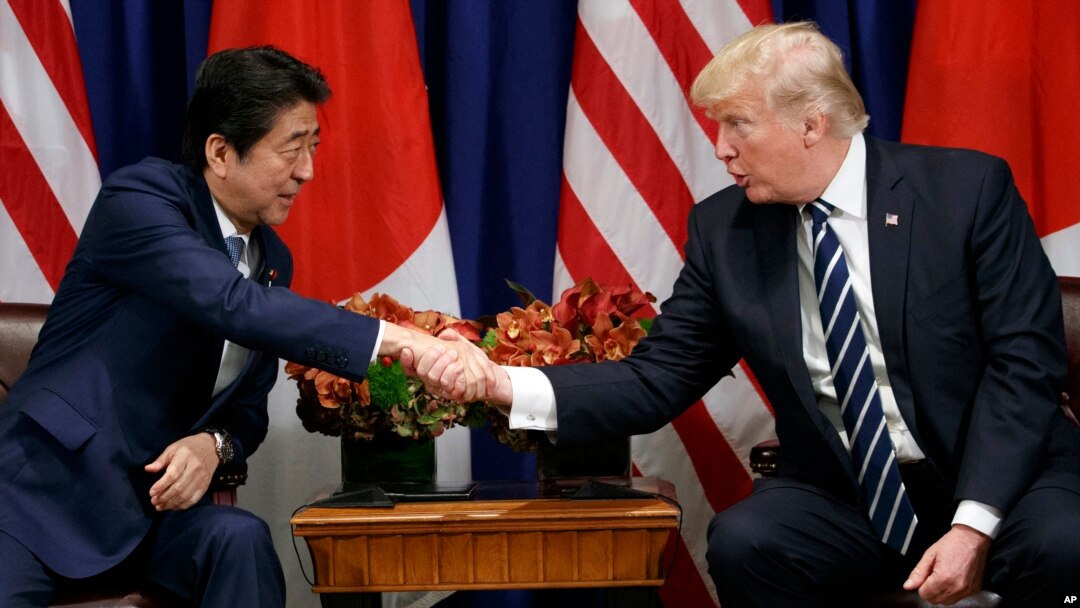 President Donald Trump shakes hands with Japanese Prime Minister Shinzo Abe during a meeting at the Palace Hotel during the United Nations General Assembly, Thursday, Sept. 21, 2017, in New York. (AP Photo/Evan Vucci)