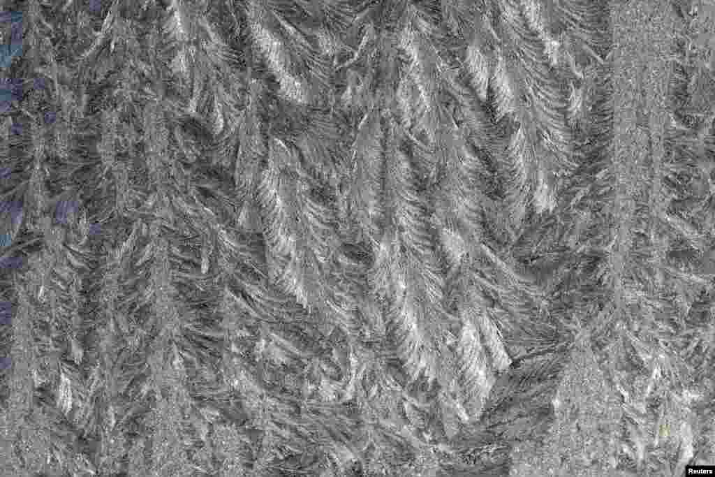 A window with frost pattern is pictured following a cold night in Bad Honnef near Bonn, Germany.