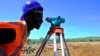 FILE - U.S. aid supports work by the U.S. Agency for International Development. Here, an engineer surveys the site of a power plant being built, with USAID’s help, near Kenya's Lake Baringo. (Courtesy USAID) 