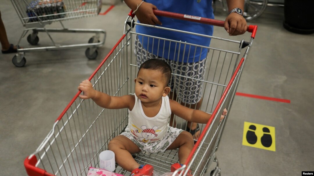A baby is seen in a store after the government eased some protective measures following the coronavirus disease (COVID-19) outbreak, in Bangkok, Thailand on June 19, 2020. (REUTERS/Jorge Silva/File Photo)