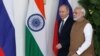 Russian President Vladimir Putin and India's Prime Minister Narendra Modi arrive ahead of their meeting at Hyderabad House in New Delhi, India, Oct. 5, 2018.