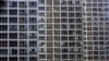 In this photo taken Oct. 30, 2008, offices and apartment buildings are shown in Beijing, China. In the sprawling megacities of Beijing, Shanghai and Chongqing, where populations exceed 10 million people, extreme urban density means that the number of peop