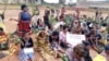 Women listen to a speaker at a protest against an ongoing conflict between government forces and armed separatists, in Bamenda, Cameroon, Sept. 7, 2018. Candidates for the upcoming presidential election have largely avoided traveling to the restive English-speaking regions where armed separatists have vowed the vote will not take place. (M. E. Kindzeka/VOA)