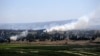 Smoke rises from the Israeli occupied Golan Heights near the Kuneitra border crossing, close to the ceasefire line between Israel and Syria, June 6, 2013.