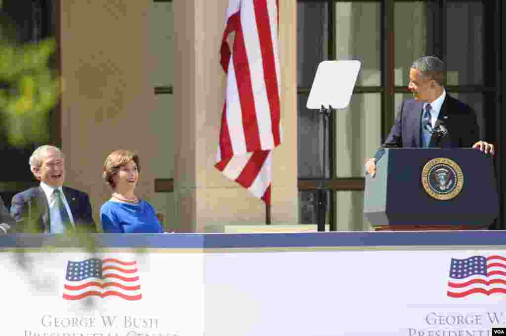 Former president George W. Bush, former first lady Laura Bush and President Obama share a lighter moment during the dedication of the George W. Bush Presidential Center, Dallas, Texas, April 25, 2013. (VOA/Brian Allen)