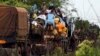 Muslims fleeing sectarian violence are on top of a truck with their belongings -- on the road between Bangui and Sibut -- on a convoy being escorted by French peacekeepers to the south eastern town of Bambari, Central African Republic, April 20, 2014.