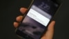 A test text message of the Presidential Alert, National Wireless Emergency Alert System is seen on a mobile phone in New York City, New York, Oct. 3, 2018.