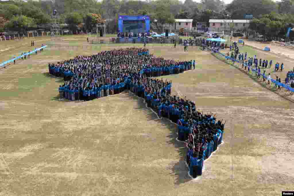 Three thousand and four hundred people form a giant human map of Myanmar organized by Telenor, in Magway, Myanmar, during an official attempt to break Guinness World Record.