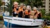 Activists, demanding cuts in global emissions, wear masks depicting, from left: Australia's Prime Minister Tony Abbot, U.S. President Barack Obama, China's President Xi Jinping, Canada's Prime Minister Stephen Harper, India's Prime Minister Narendra Modi,
