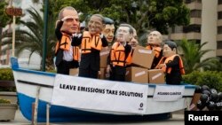 Activists, demanding cuts in global emissions, wear masks depicting, from left: Australia's Prime Minister Tony Abbot, U.S. President Barack Obama, China's President Xi Jinping, Canada's Prime Minister Stephen Harper, India's Prime Minister Narendra Modi,