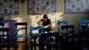 A Filipino woman votes during the country's midterm elections inside a polling center at a school in Manila, Philippines on Monday, May 13, 2019. 