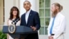 U.S. President Barack Obama stands with Bob Bergdahl (R) and Jami Bergdahl (L) as he delivers a statement about the release of their son, prisoner of war U.S. Army Sergeant Bowe Bergdahl, in the Rose Garden at the White House in Washington May 31, 2014.