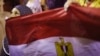 A girl holds Egypt's flag as she attends a sit-in protest organized by supporters of the deposed Egyptian President Mohamed Mursi, Cairo July 11, 2013.
