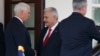 Vice President Mike Pence, left, shakes hands with Turkish Prime Minister Binali Yildirim after a meeting at the White House, Nov. 9, 2017, in Washington.