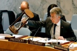 FILE - Germany's Ambassador and current president of the Security Council Christoph Heusgen resets an hour glass between speakers at United Nations headquarters, Monday, April 29, 2019.
