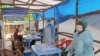 In this photo taken on Sunday, July 27, 2014, Medical personnel inside a clinic taking care of Ebola patients in the Kenema District on the outskirts of Kenema, Sierra Leone. Liberia President Ellen Johnson Sirleaf has closed some border crossings and o