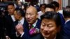 Han Kuo-yu, center, the newly elected legislative speaker from Taiwan's largest opposition party, the Kuomintang, greets the media in Taipei on Feb. 1, 2024.