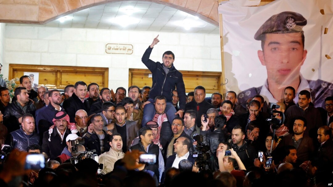 Supporters and family members of Jordanian pilot, Lt. Muath al-Kaseasbeh, express their anger at his reported killing in Amman, Jordan, February, 3, 2015.