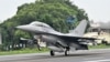 FILE - An U.S.-made F-16V fighter jet lands on the freeway in Changhua county, central Taiwan, May 28, 2019. 