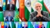 This handout photograph released by India's Press Information Bureau shows Indian Prime Minister Narendra Modi greeting leaders of central Asian countries during a virtual meeting, in New Delhi, India, Jan. 27, 2022. 