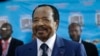 In this Oct. 7, 2018 photo, Cameroon's Incumbent President Paul Biya waits to casts his vote during the presidential elections in Yaounde, Cameroon. 