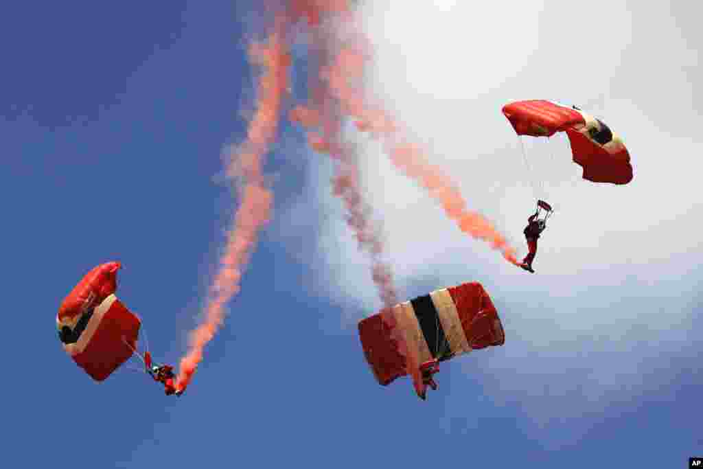The British Army's Parachute Regiment display team, the Red Devils, performs during the Farnborough International Air Show, Farnborough, England.