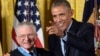 President Barack Obama points after presenting the Medal of Honor to retired Lt. Col. Charles Kettles of Michigan during a ceremony in the East Room of the White House in Washington, July 18, 2016. 