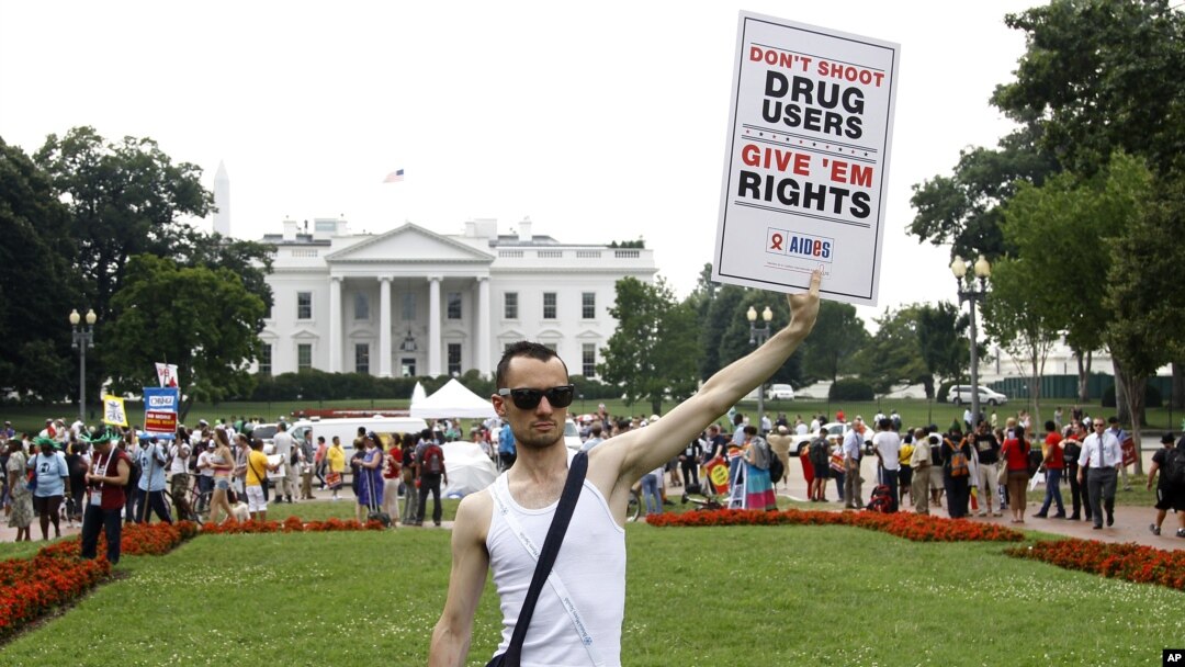 Vincent Leclercq of France demonstrates in front of the White House in Washington as the AIDS conference continues in Washington, July 24, 2012.