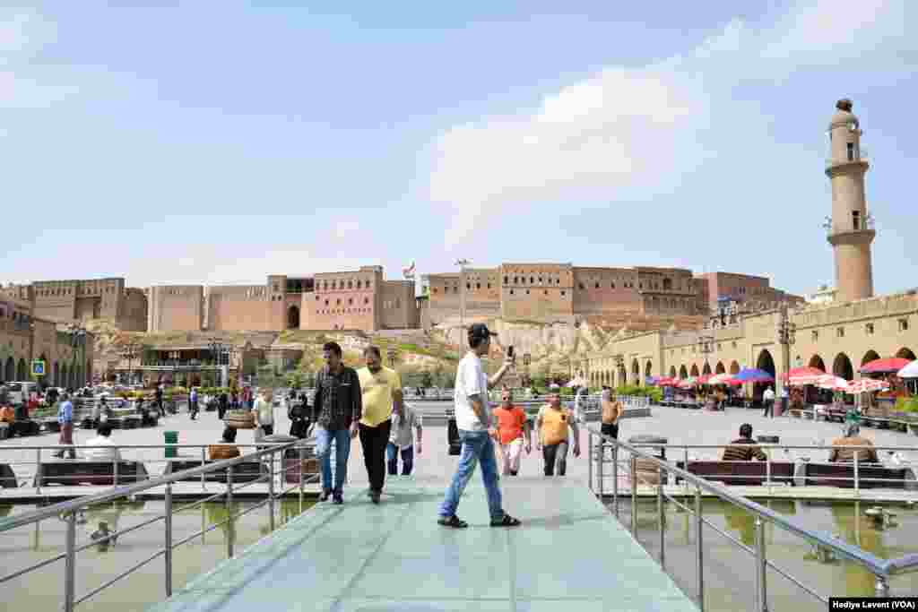 Visitors crowd the square in front of the castle, in Irbil, Iraq.