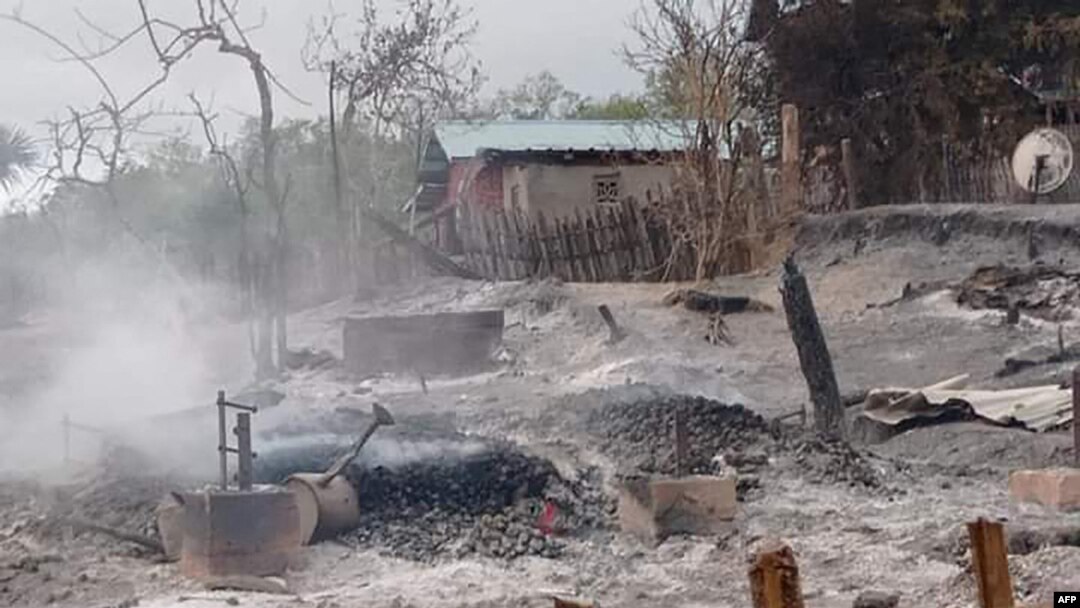 FILE - This handout from Pauk Township News taken and released June 16, 2021, shows the remains of houses after they were burnt by Myanmar soldiers in Kin Ma village, Pauk Township, in Myanmar's Magway region.