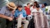 Pearl Harbor survivors, ages 104 and 102, return to Hawaii for attack anniversary
