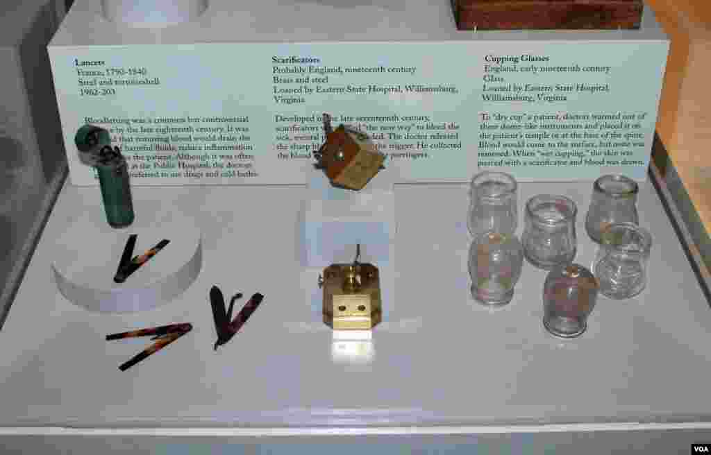 The lancers (left) were used to bleed the patient to "remove harmful fluids". Scarificators (center) were bloodletting tools with a spring-loaded mechanism that snapped the blades out through slits to pierce the skin. With cupping (right), doctors warmed