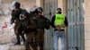 FILE - Israeli soldiers detain a local Palestinian cameraman during clashes with Palestinians in the village of Tuqu, near Bethlehem, in the Israeli-occupied West Bank, Jan. 25, 2019.