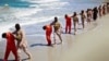 FILE - This undated image made from video released by Islamic State militants April 19, 2015, purports to show a group of captured Ethiopian Christians taken to a beach before being executed. 