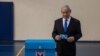 Israeli Prime Minister Benjamin prepares to vote at a voting station in Jerusalem on Sept. 17, 2019. 