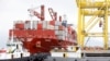Containers are loaded onto a ship at Tien Sa port in Da Nang, Vietnam, March 6, 2020. 