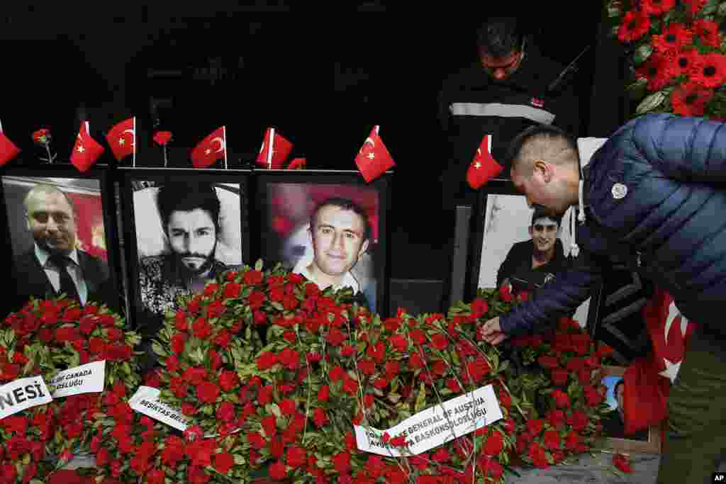 A man leaves a carnation outside Reina nightclub as people gather to remember the victims of a deadly New Year's attack a year ago, in Istanbul, Turkey. Thirty-nine people were killed — mostly foreigners — and 79 wounded when an assailant shot his way into the Reina nightclub where hundreds were celebrating the New Year.