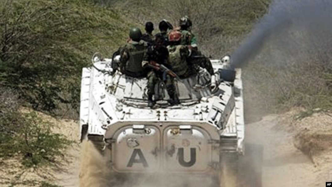 African Union peacekeepers patrol in a tank as they assist Somalia government forces during clashes with insurgents in southern Mogadishu, March 9, 2011