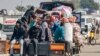 A truck carrying people fleeing from the central Gaza Strip with their belongings arrives in Rafah in the southern Gaza Strip following an evacuation order on December 26, 2023, amid the ongoing conflict between Israel and the Palestinian militant group H