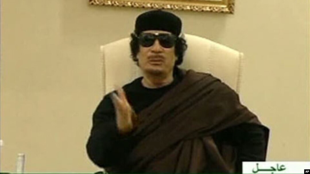 Still image from a video shows Gaddafi gesturing as he speaks at a Tripoli hotel (file photo)