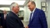 In this July 9, 2017, photo made available July 10, 2017, Turkey's President Recep Tayyip Erdogan, right, shakes hands with U.S. Secretary of State Rex Tillerson, left prior to their meeting in Istanbul. 