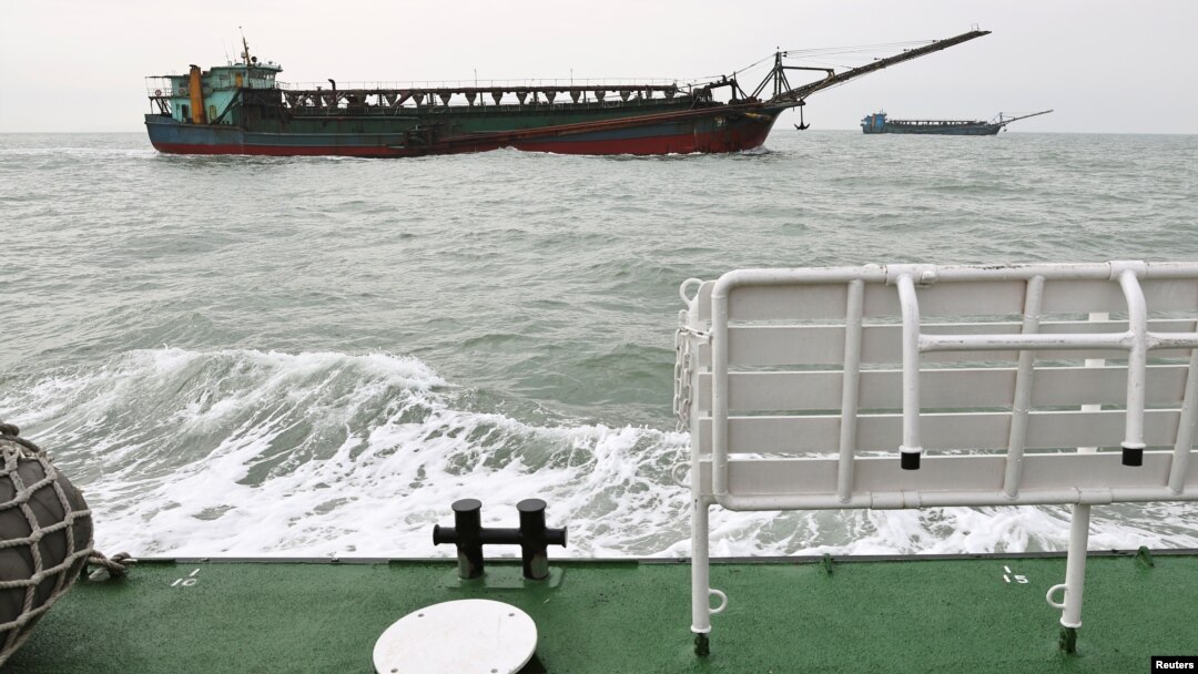 FILE - Sand-dredging ships with Chinese flags are seen from a Taiwanese coast guard ship patrolling in the waters off the Taiwan-controlled Matsu islands, January 28, 2021. Picture taken January 28, 2021. (REUTERS/Ann Wang)