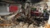 FILE - In this photo released by the Syrian official news agency SANA, a damaged building targeted by Israeli missile strikes is seen in the early morning in the Mezzeh area in the capital Damascus, Syria, Nov. 12, 2019. 