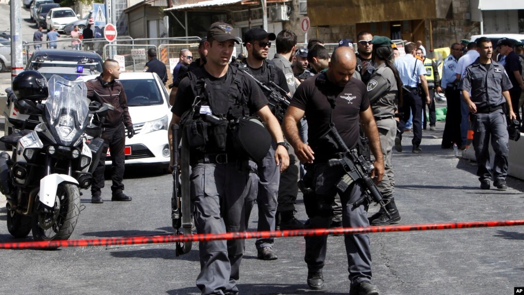Israeli police secures the scene where a Palestinian gunman was shot dead in Jerusalem, Oct. 9, 2016.
