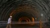 A policeman stands guard at the Zojila tunnel under construction which connects Srinagar, Kashmir, to the Indian union territory of Ladakh bordering China.