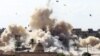 Smoke rises after a house is blown up during a military operation by Egyptian security forces in the Egyptian city of Rafah, near the border with southern Gaza Strip, Oct. 29, 2014.