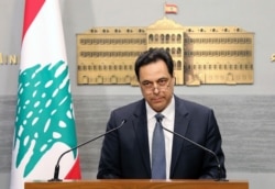 FILE - Lebanese Prime Minister Hassan Diab gives a speech at the Government House in Beirut, March. 7, 2020.