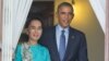 FILE - President Barack Obama, right, walks out with Myanmar's Aung San Suu Kyi at her home before the start of their joint news conference in Yangon, Myanmar. 