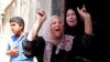 Palestinian relatives of Haitham Mishal, 29, react during his funeral in the Shati Refugee Camp in Gaza City, April 30, 2013.
