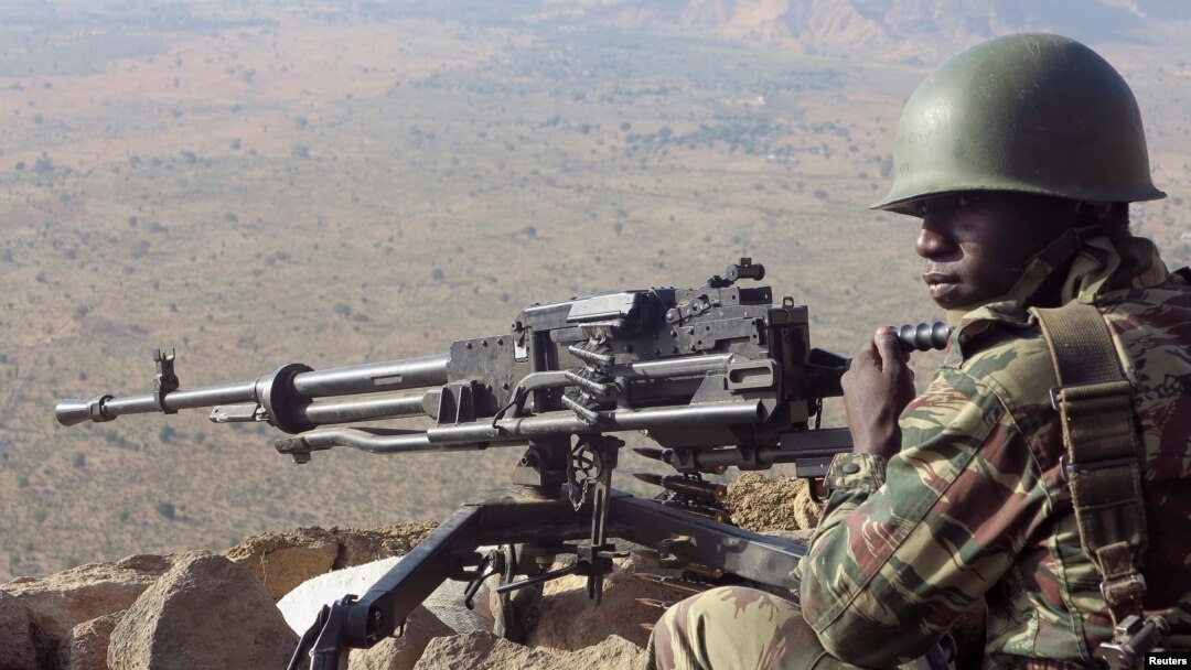 FILE - A Cameroonian soldier guards at an observation post on a hill in the Mandara Mountain chain in Mabass overlooking Nigeria, northern Cameroon.